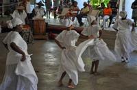 Members of the Per Ankh Dance Troupe perform a bamboula dance as drummers beat a rhythm in the background. Members of the Per Ankh Dance Troupe perform a bamboula dance as drummers beat a rhythm in the background.